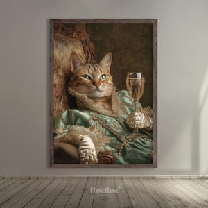 May include: A framed print featuring a regal cat in a vintage dress, holding a glass of champagne. The cat is seated in an ornate chair, wearing a teal dress with lace and pearls. The artwork has a vintage, renaissance style.