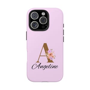 May include: A pink phone case with a gold letter A and floral design. The name Angeline is printed below the letter.