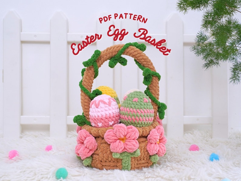 May include: A crocheted Easter egg basket with a brown handle and green vines. The basket is filled with three crocheted eggs, one pink, one green, and one yellow.