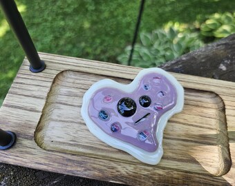 Fused glass cookie magnet w/face (bite missing)