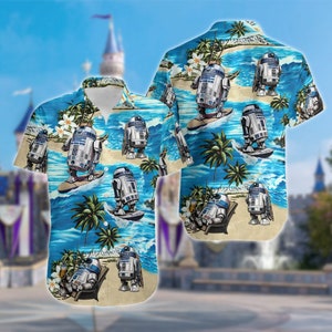 May include: A blue and beige Hawaiian shirt with a repeating pattern of R2-D2 robots surfing on waves, palm trees, and flowers.