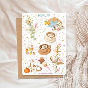 May include: A sticker sheet with various illustrations, including a sword, a hat with lemons, coffee, a cat, and an ice cream cone. The text "Misc_03" is at the top, and "by nellisSketchbox" is at the bottom. The background is white with colorful dots.