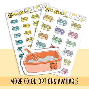 May include: Two sticker sheets featuring rows of small cat litter box illustrations in various pastel and primary colors, each with a matching scoop. A single, larger die-cut sticker of an orange litter box with a cat face icon is placed in front.