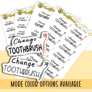 May include: A collection of white sticker sheets featuring a repeating black text design that reads Change TOOTHBRUSH, accompanied by small illustrations of toothbrushes in various colors including pink, green, and orange, with a bee logo at the top.