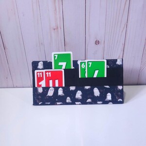 Support pour cartes à jouer, Faciliter la manipulation des cartes dans les mains