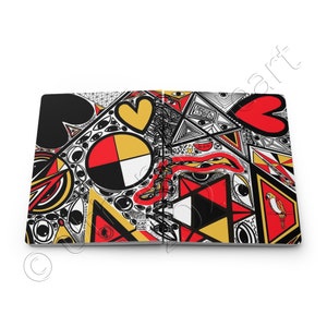 May include: A spiral bound notebook with a colorful abstract design featuring red, yellow, black, and white geometric shapes, eyes, and hearts. The cover is filled with intricate patterns and doodles.