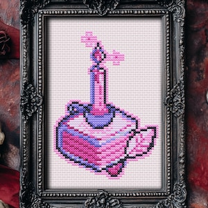 May include: A pink and purple cross-stitch pattern of a bottle with a candle on top. The bottle has a heart shape and is decorated with flowers.