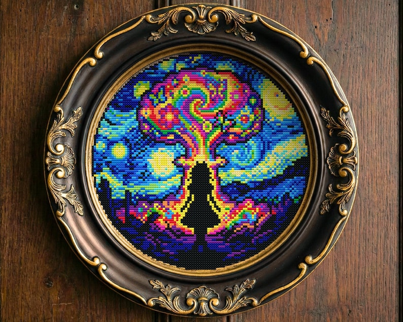 May include: A framed cross-stitch artwork depicting a girl's silhouette with a vibrant, swirling design above. The design uses blues, yellows, greens, and reds, creating a psychedelic effect. The black frame has gold detailing.
