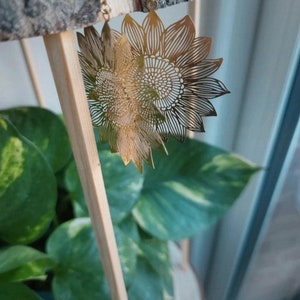 Gold plated brass flower sun hoop earrings
