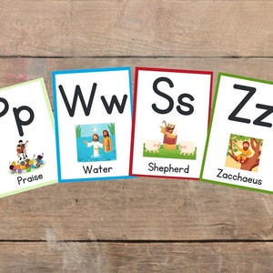 May include: Five colorful flashcards with uppercase and lowercase letters, each with a corresponding image and word. The letters are P, W, S, and Z. The words are Praise, Water, Shepherd, and Zacchaeus.