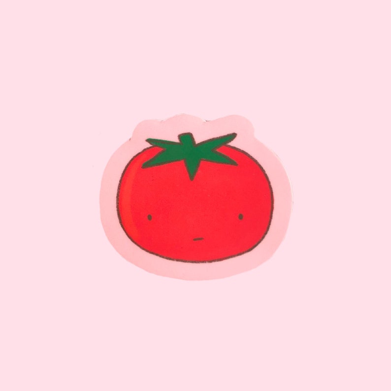 Puede incluir: Un tomate rojo con un tallo verde y una cara de dibujos animados, sobre un fondo rosa.