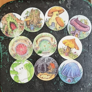 May include: Nine colorful illustrations of whimsical houses with different styles and designs. Each illustration features a unique door, window, and surrounding landscape. The houses are painted in a variety of colors, including green, blue, red, and yellow.