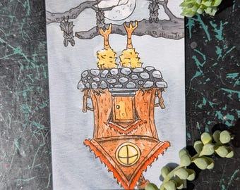 May include: A watercolor illustration of a small, brown, wooden house with a stone roof. The house has a small door and a round window. Two yellow, fluffy creatures with long legs are perched on the roof, looking up at the full moon. Bats are flying in the trees above the house.