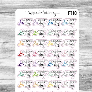 May include: A sheet of stickers with the words "Laundry Day" and a hanger graphic in various colors. The stickers are from Twisted Stationery and have the product code F110.