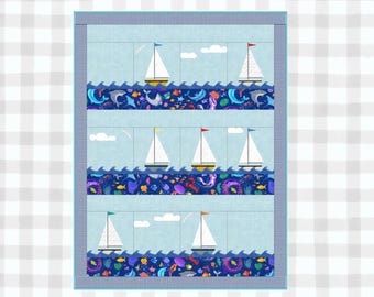 May include: A blue and white quilt with a nautical theme. The quilt features sailboats, sea creatures, and waves. The quilt is made of cotton fabric and is machine washable.