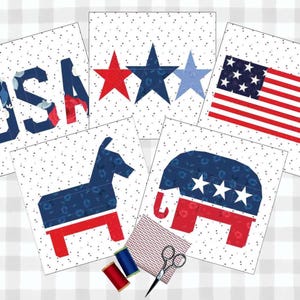 May include: A collection of patriotic-themed fabric squares with the word "USA", stars, an American flag, a donkey, and an elephant. The squares are on a white background with small black dots. Sewing supplies, including thread and scissors, are also present.