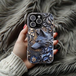 May include: A clear phone case with a blue and gold wolf design. The wolf is surrounded by ornate floral patterns. The case has a raised camera bump with three black camera lenses.