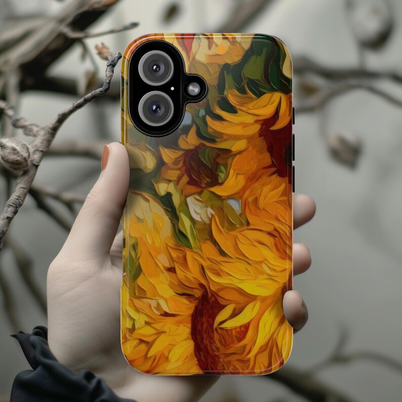 May include: A phone case with a vibrant sunflower design. The case features a close-up of sunflowers in shades of yellow, orange, and green, painted in a stylized, almost abstract style.