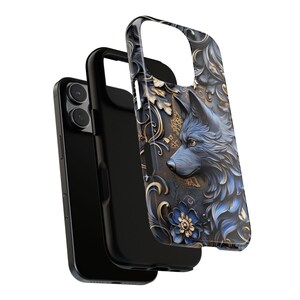 May include: A black phone case with a wolf's head design. The wolf is blue and gray with gold accents. The background is a dark blue with gold floral patterns.