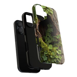 May include: A black phone case with a green and brown mossy tree bark design. The case has a cutout for the camera lens.