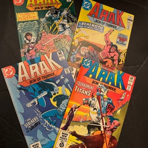 May include: Four comic books featuring the superhero Arak, Son of Thunder. The covers feature colorful illustrations of Arak battling various foes, including a giant monster, a group of warriors, and a creature from the underworld. The comic books are from the 1970s and are in good condition.