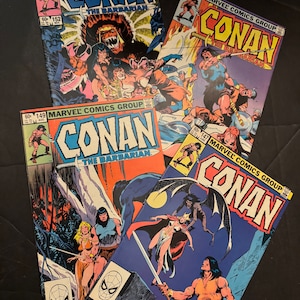 May include: Four vintage Conan the Barbarian comic books from Marvel Comics. The covers feature action-packed illustrations of Conan in various scenes, with vibrant colors and dynamic artwork. Each comic displays the title "Conan the Barbarian" in bold lettering.