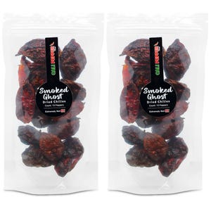 May include: Two clear plastic bags filled with dried, dark red Smoked Ghost chilies. Each bag has a black label with white text that reads "Smoked Ghost Dried Chilies Count: 15 Peppers Extremely Hot" and a green and red logo that says "CALI PEPPER".