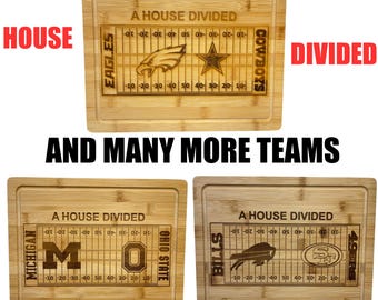 May include: Three rectangular bamboo cutting boards featuring laser-engraved football field designs. Each board displays the text A HOUSE DIVIDED above a gridiron graphic with team logos and names, including Eagles, Cowboys, Michigan, Ohio State, Bills, and 49ers.