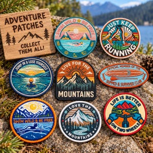 May include: A collection of eight embroidered circular and oval patches featuring outdoor themes, including mountains, swimming, running, and cycling, with text such as Swim Wild Be Free, Just Keep Running, and Live for the Mountains, alongside a wooden sign.