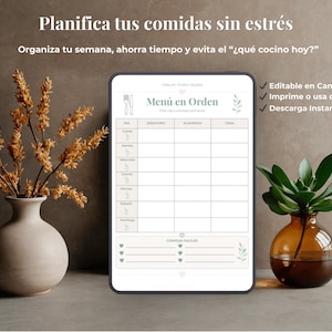 May include: A digital meal planner on a tablet with the text "Menú en Orden". The planner is designed to help organize weekly meals. The image includes a vase with dried flowers and a small plant in a brown glass vase.