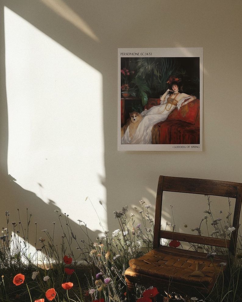 May include: A framed print of a painting titled "Persephone (c.1443)" - Goddess of Spring. The painting depicts a woman in a white gown with a dog sitting beside her. The woman is wearing a crown of flowers and a necklace. The painting is set against a dark background with lush greenery.