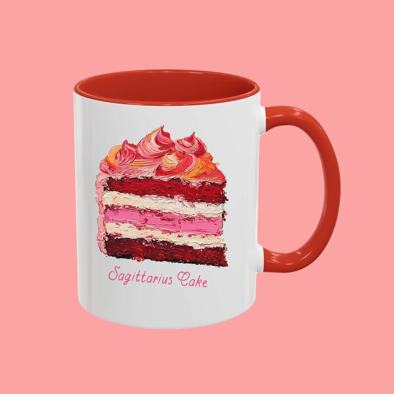 May include: White ceramic mug with a red rim and handle. The mug features a colorful painting of a slice of cake with the text "Sagittarius Cake" underneath.