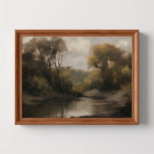 May include: A framed painting depicting a tranquil woodland scene with a winding river in the foreground. The trees are a mix of green and brown, and the sky is a soft grey. The painting has a muted colour palette and a realistic style.