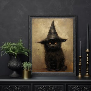 May include: A black cat wearing a witch's hat with a pointed top and a wide brim. The cat has yellow eyes and is sitting on a brown background. The image is framed in black.