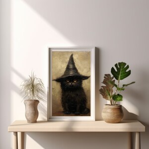 May include: A black cat wearing a witch's hat with a pointed top and a wide brim. The cat has orange eyes and is sitting on a brown background.