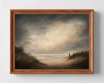 May include: A framed landscape painting depicts a beach scene under a cloudy sky. The artwork features a path leading to the ocean, with dunes and a fence on either side. A bird flies in the distance, adding a sense of tranquility.