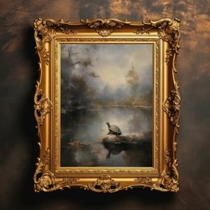 May include: A vintage-style gold frame with ornate details surrounds a painting of a turtle on a rock in a tranquil lake setting. The painting depicts a serene landscape with trees and water, creating a peaceful and natural scene.