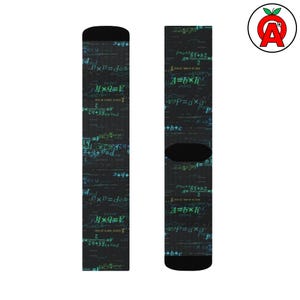 May include: A pair of black socks featuring a pattern of mathematical equations and formulas in white, green, and yellow. The socks have a black heel and toe. A quirky and unique accessory.
