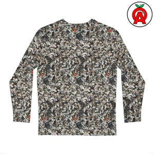 May include: Long-sleeved shirt featuring a repeating pattern of small, grey and white objects, possibly cigarette butts. The shirt has a crew neck and a fitted design. Small red accents are scattered throughout the pattern.