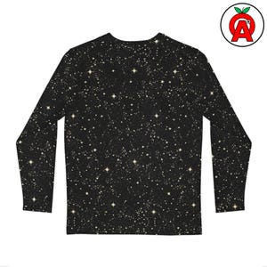 May include: Black long-sleeve shirt with a celestial pattern of stars and constellations in shades of gold and cream. The shirt has a crew neck and a fitted design. The overall theme is astronomy and space.