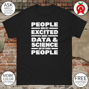 May include: Black t-shirt with white text that reads: "PEOPLE WHO GET EXCITED ABOUT DATA & SCIENCE ARE MY KINDA PEOPLE." The shirt has a crew neck and short sleeves. The text is in a bold, sans-serif font.