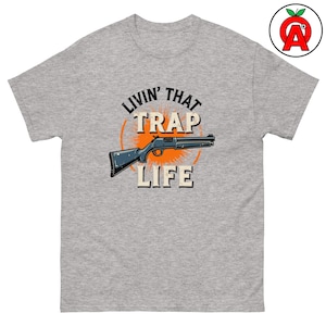 Leva det fälllivet Vuxen unisex T-shirt, fällskytte-ordvits, trasig lerduvegrafik, lerduveskytte-t-shirt, sportkläder för lerduvor