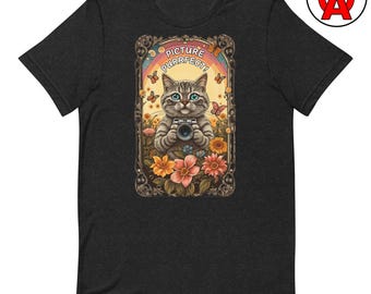May include: A charcoal gray t-shirt featuring a graphic of a tabby cat holding a camera. The cat is framed by an ornate border with flowers, butterflies, and a rainbow. The text "PICTURE PURRFECT!" is printed in white above the cat's head.