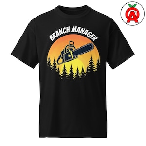 May include: Black t-shirt featuring a chainsaw graphic with the text "Branch Manager" in white. The design includes a yellow and orange sunset and a silhouette of pine trees. A fun and unique design for anyone.