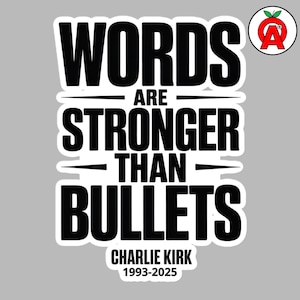 May include: A sticker with the text "WORDS ARE STRONGER THAN BULLETS" in bold, black letters. Below the text is "CHARLIE KIRK 1993-2025". The sticker has a white border and a gray background. A logo is in the upper right corner.