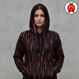 A female cybersecurity analyst in her 20s with edgy tech-forward style showing off Matrix Code AOP Hoodie, Binary Pattern Unisex Top, Digital Rain Graphic Pullover, Cyberpunk Soft Sweater, Computer Programming AOP Hoodie