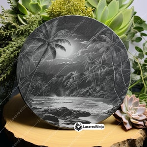 May include: A black slate coaster with a laser-etched design of a tropical beach scene with palm trees, a moon, and waves. The coaster has the text "LaseredNinja" in white lettering.