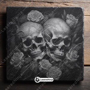 May include: Two black and white skulls with intricate details are surrounded by roses and leaves. The skulls are facing each other and appear to be intertwined. The background is a dark gray.