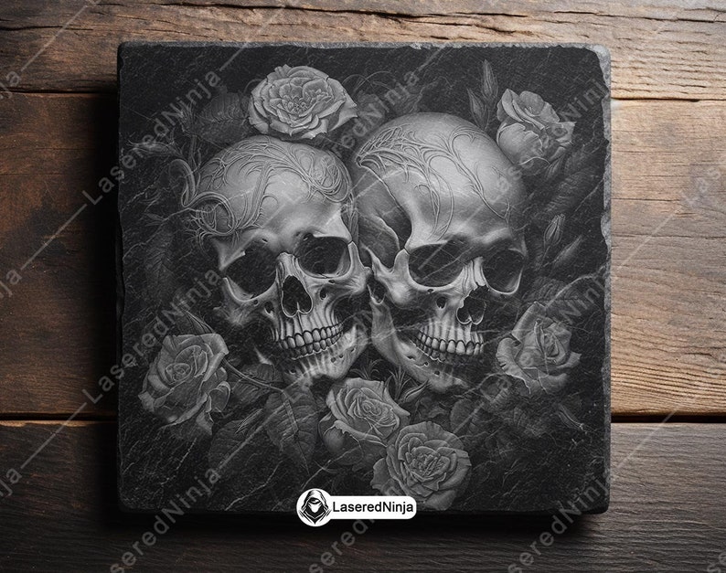 May include: Two black and white skulls with intricate details are surrounded by roses and leaves. The skulls are facing each other and appear to be intertwined. The background is a dark gray.
