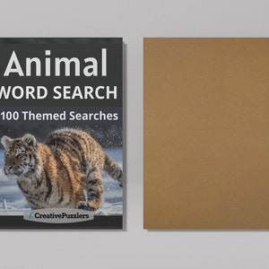 May include: A spiral bound book with a black cover featuring a tiger running through snow. The title is "Animal Word Search" with the subtitle "100 Themed Searches". The book is published by CreativePuzzlers.